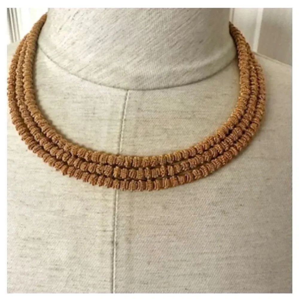 Gold tone multi strand necklace